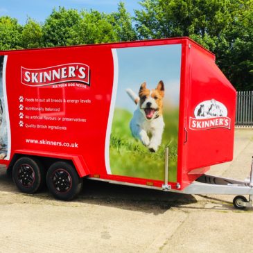 Skinners stunning new Product marketing trailer sprayed in red with all round graphics including roof branding,  wet weather awning, open plan displays, spotlights, internal storage and water tank.